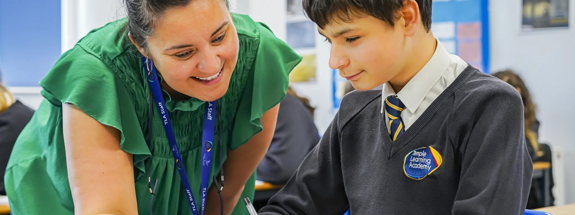 Pupil working with teacher